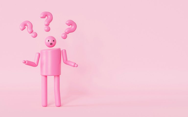 Ein pinkfarbener, humanoider Charakter mit Fragezeichen über dem Kopf.